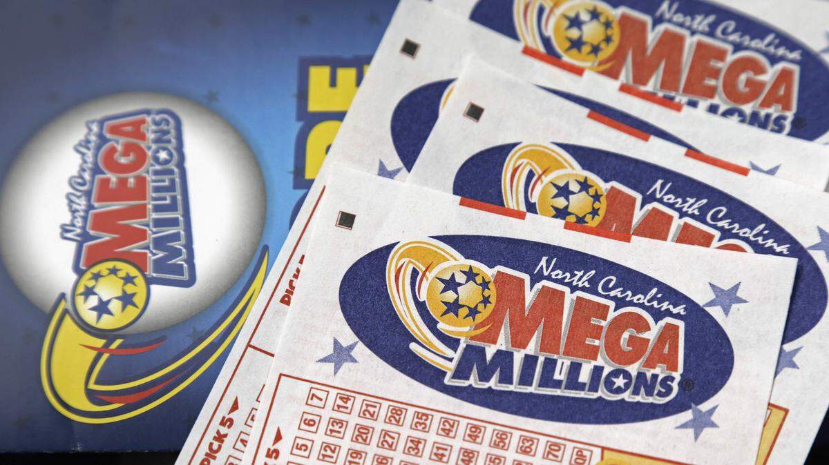 Mega Millions lottery tickets rest on a counter at a store near Burlington, N.C. The Mega Millions drawings are on Tuesday and Friday.