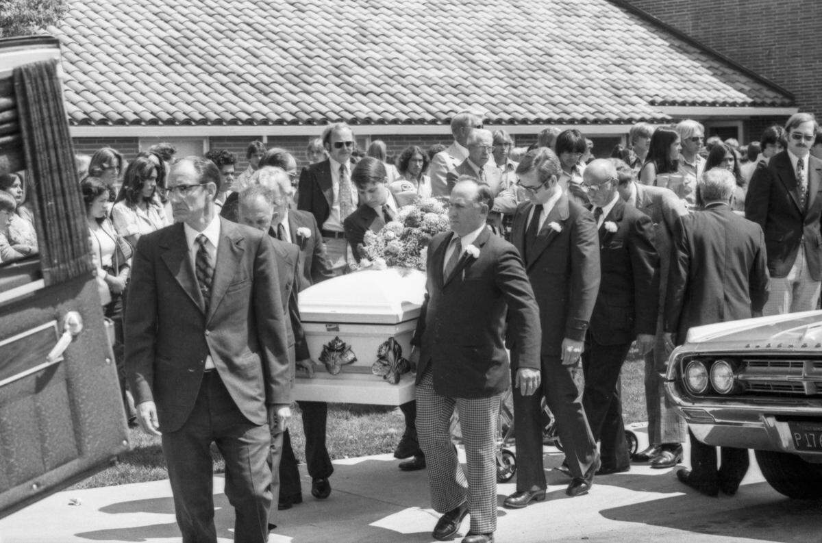 Pallbearers carry a casket outside the Yuba City Ward of the Church of Jesus Christ of Latter-day Saints on May 24, 1976. The service – one of five held in the city that day for the 29 killed in the school bus crash days before – was for victims Ruth Annette Bowen, twins Sharleen Rene and Carlene Diane Engle, Pamela Susan Engstrom and Joanne Arlene Matson.