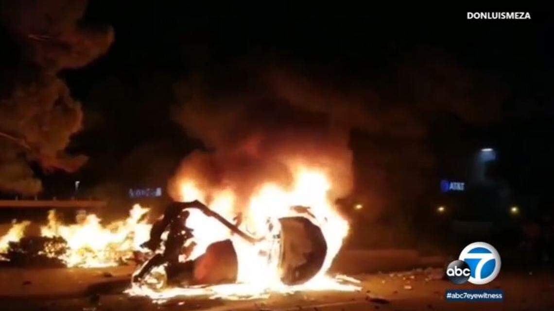 Police are seeking a street racer who slammed into a car in Palmdale, California, causing a fiery crash killing a Lyft driver and passenger.
