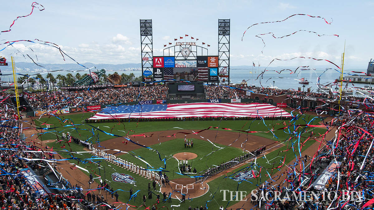 Streamers fly through the air following the singing of the National Anthem on Opening Day baseball between the San Francisco Giants and Arizona Diamondbacks on April 10, 2017 at AT&T Park in San Francisco.