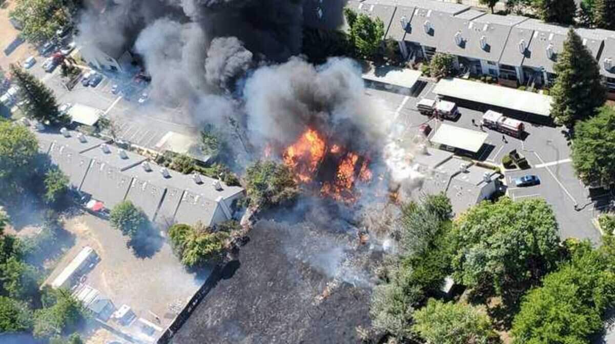Firefighters battled a grass fire on Monday June 29, 2020, that spread to a housing complex near Wyda Way and Wright Street in the Arden Arcade.