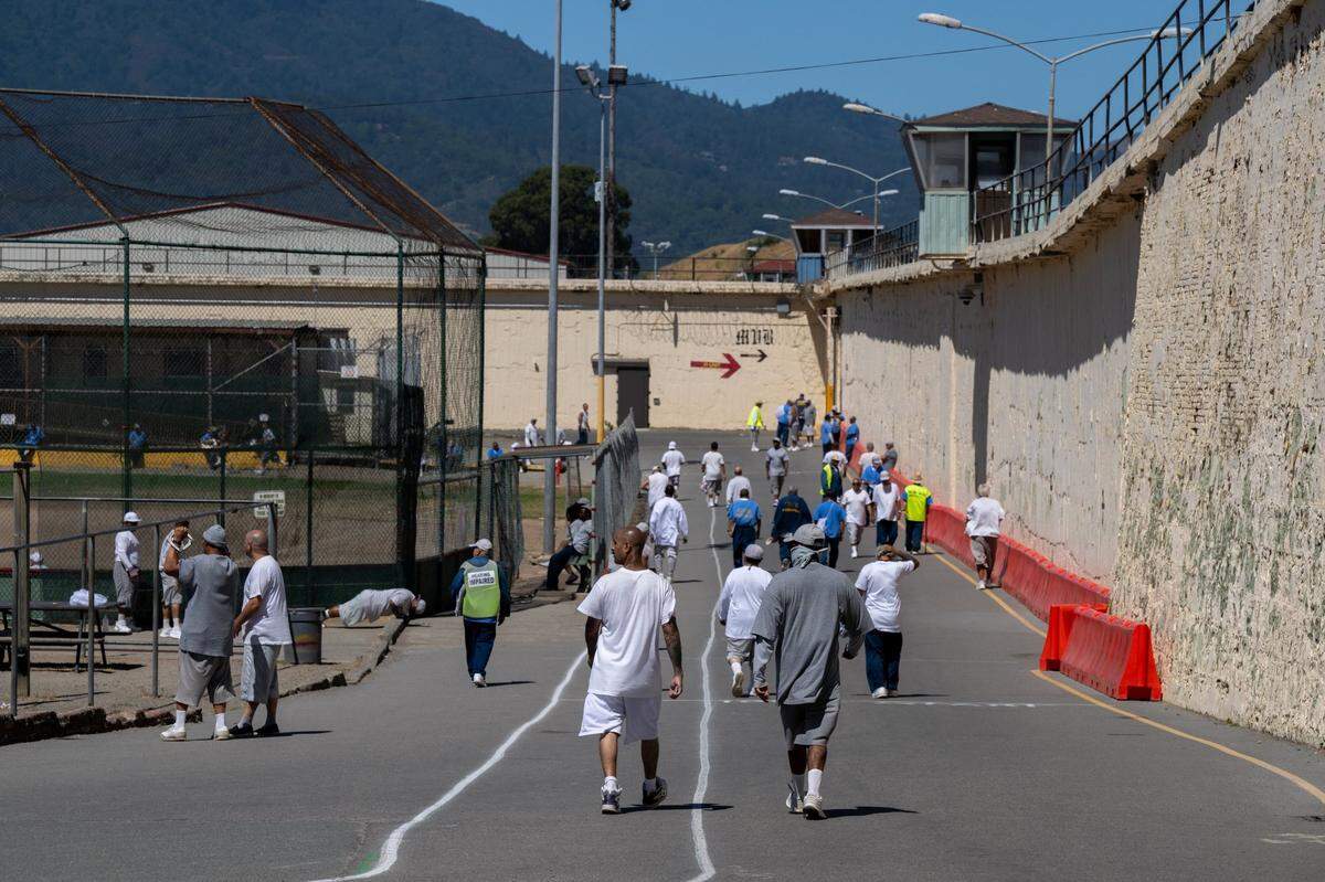 Inmates exercise outside in the yard at San Quentin State Prison on July 26, 2023. In March 2023, Gov. Newsom announced a plan to transform the prison into the San Quentin Rehabilitation Center.