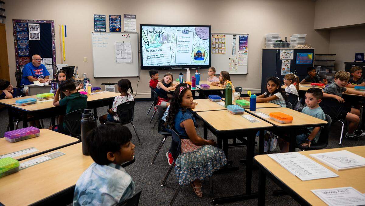Third grad teacher Don McCarthy takes roll in class on the first day of school at Riverview STEM Academy on Thursday, Aug. 7, 2025.
