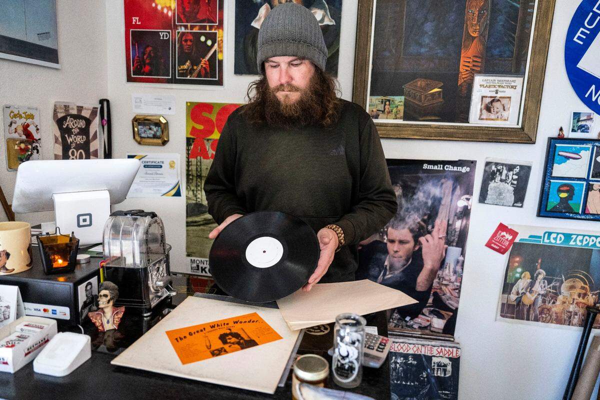 Chris Holmes, owner of Sound Annex record store in Yuba City, holds a copy of “Great White Wonder” on vinyl on Tuesday. The record is considered the first notable bootleg of rock music.