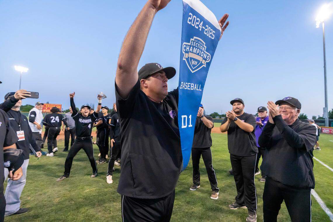 Franklin High School coach Bryan Kilby holds the section championship banner after a 4-3 win over St. Mary’s in the CIF Sac-Joaquin Section Division I baseball title game at Sacramento City College in May 2025. The victory marks one of two section championships Kilby leads the Wildcats to during his tenure, contributing to his 300 career wins, a milestone he made Friday.
