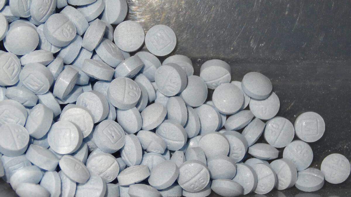 This undated file photo provided by the U.S. Attorneys Office for Utah and introduced as evidence at a trial shows fentanyl-laced fake oxycodone pills collected during an investigation. A Colorado couple is facing drug trafficking and first-degree murder charges months after their toddler died from fentanyl exposure, according to authorities.