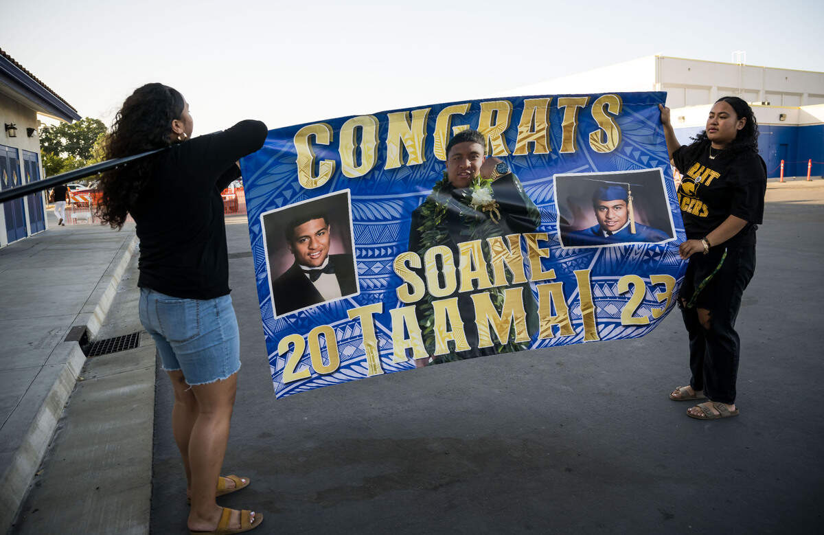 Soane Taamai’s family set up to celebrate his graduation from Grant Union High School, Tongan style, as the ceremony takes place inside the stadium Thursday, June 1, 2023, in Sacramento’s Del Paso Heights neighborhood.