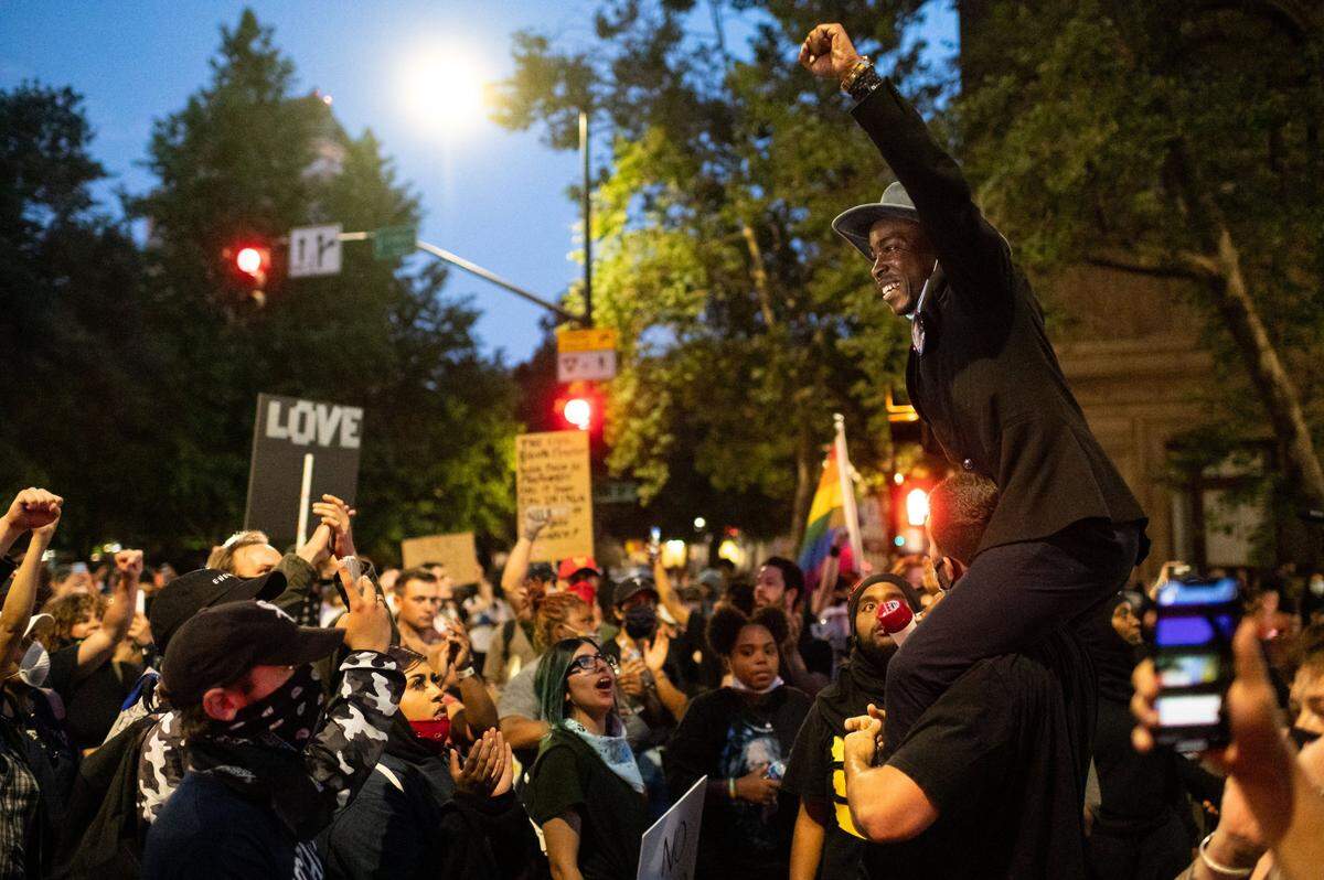 Stevante Clark — whose brother Stephon Clark was killed by police in 2018 — speaks while hoisted on a supporter in front of City Hall on Monday, June 1, 2020, during another day of protests after George Floyd was killed by police in Minneapolis.