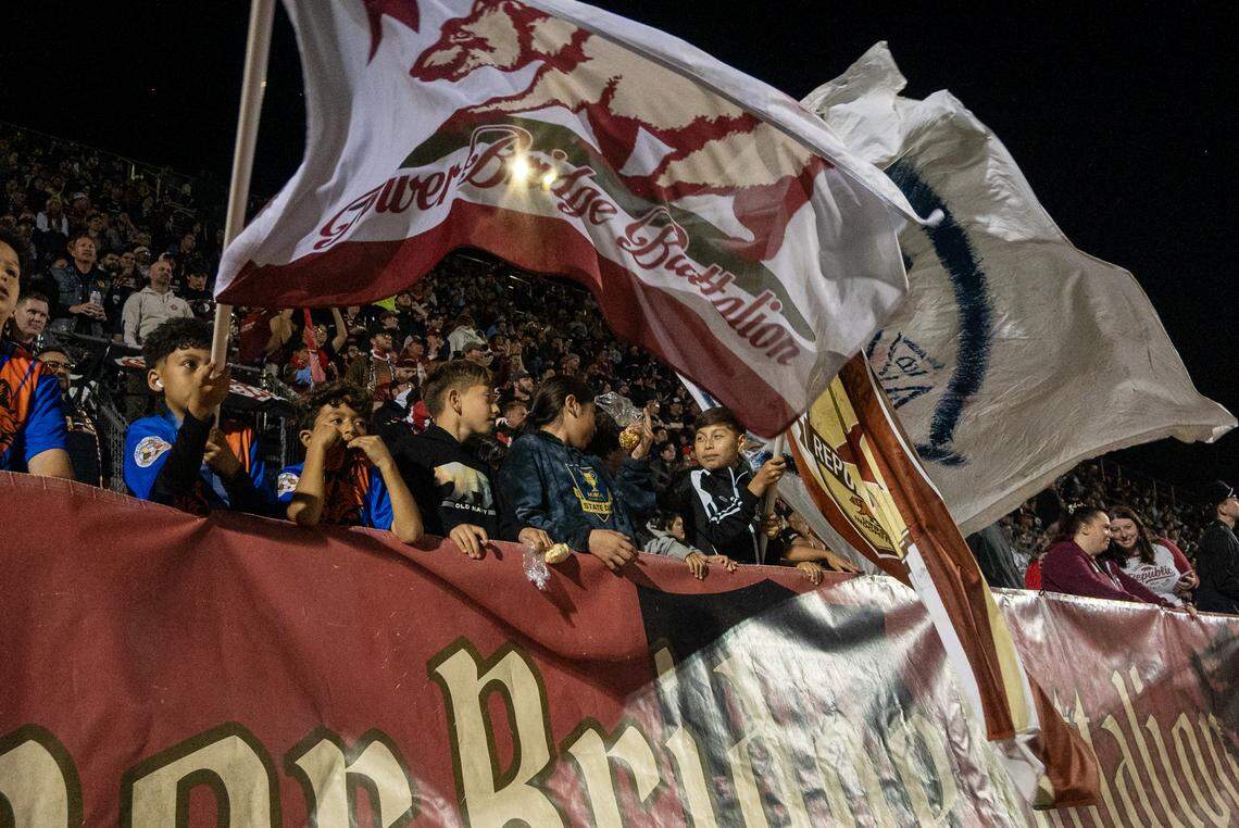 Kids wave the Tower Bridge Battalion flag during the Republic FC’s&nbsp;season-opening match against FC Tulsa on Saturday, March 7, at Heart Health Park in Sacramento.