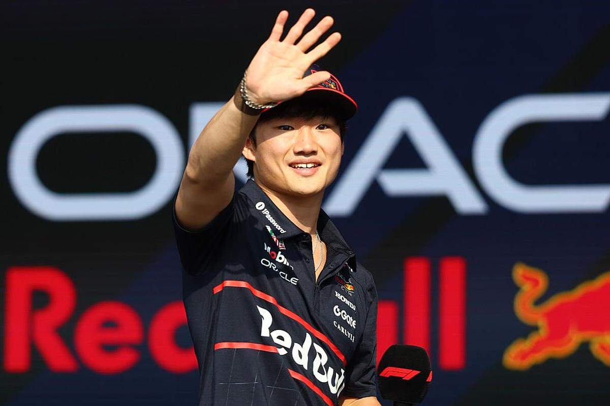 LUSAIL CITY, QATAR - NOVEMBER 29: Yuki Tsunoda of Japan and Oracle Red Bull Racing talks on the fan stage prior to the Sprint ahead of the F1 Grand Prix of Qatar at Lusail International Circuit on November 29, 2025 in Lusail City, Qatar. (Photo by Mark Thompson/Getty Images)
