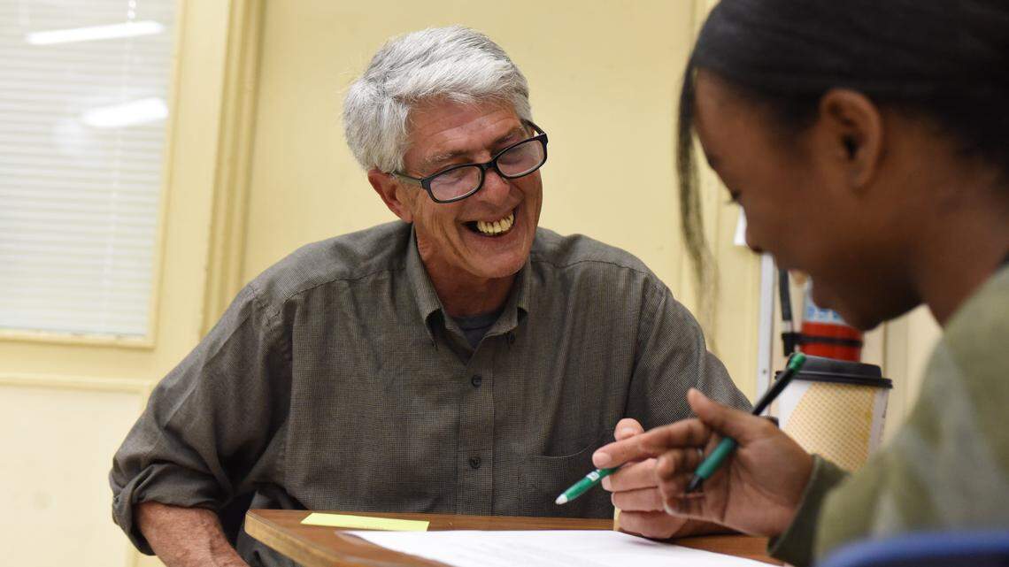 Local poet Phillip Larrea guest editing a poem with a student.