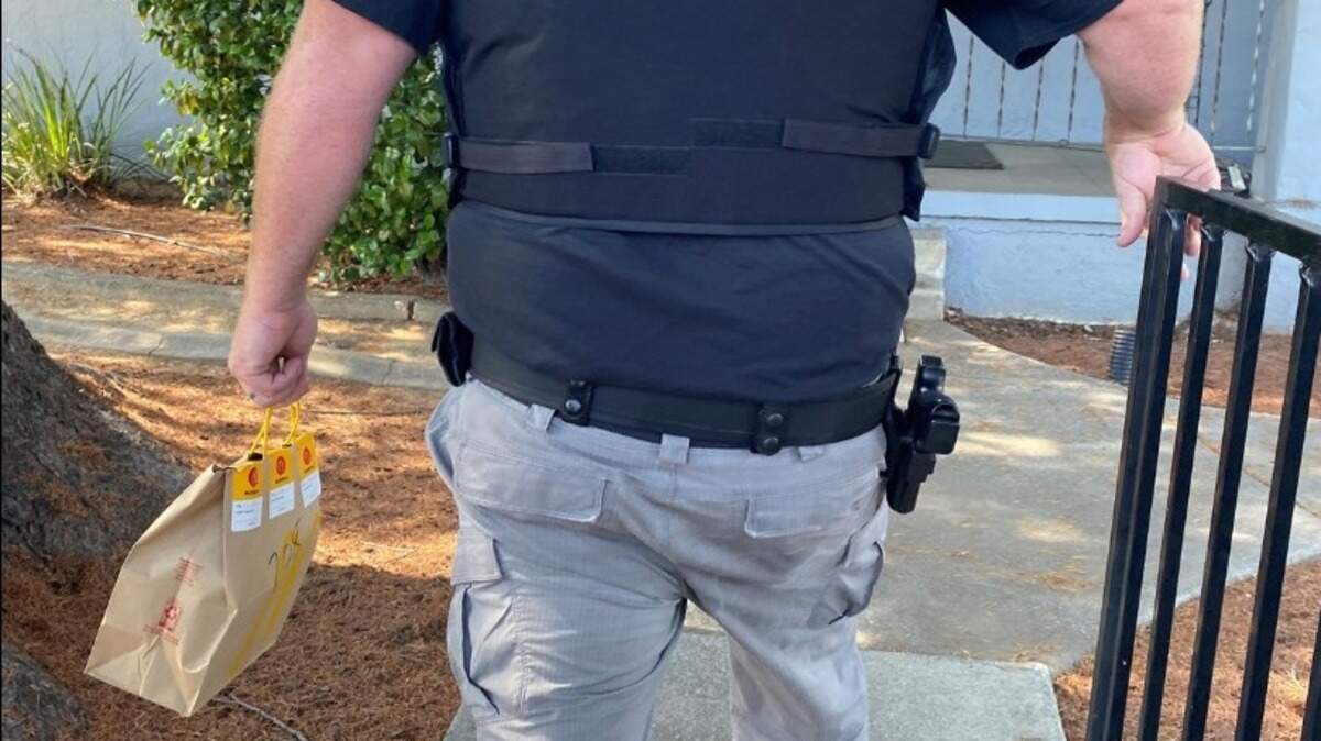 A Placer County Probation Officer makes a DoorDash delivery himself after arresting the driver on June 25, 2022.