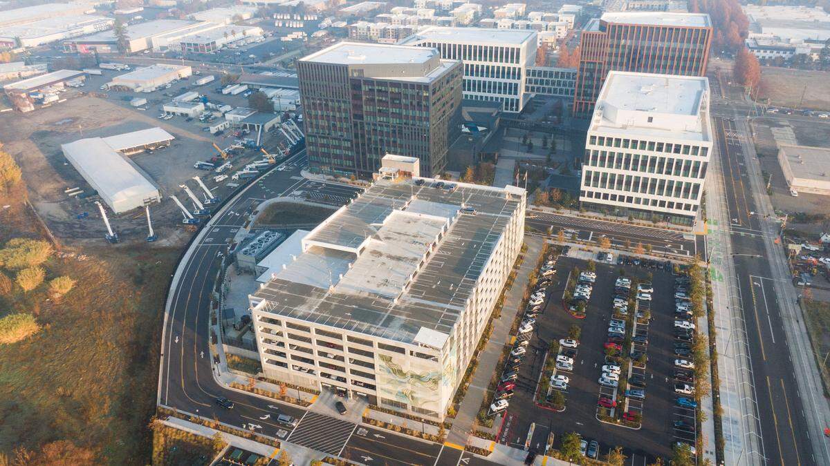 State workers finish their commutes earlier this month to the May S. Lee State Office Complex in Sacramento, where a seven-story parking structure provides 1,291 spaces. With its surface lots, the new complex features 1,600 spaces, 80% of which are devoted to monthly pass holders.