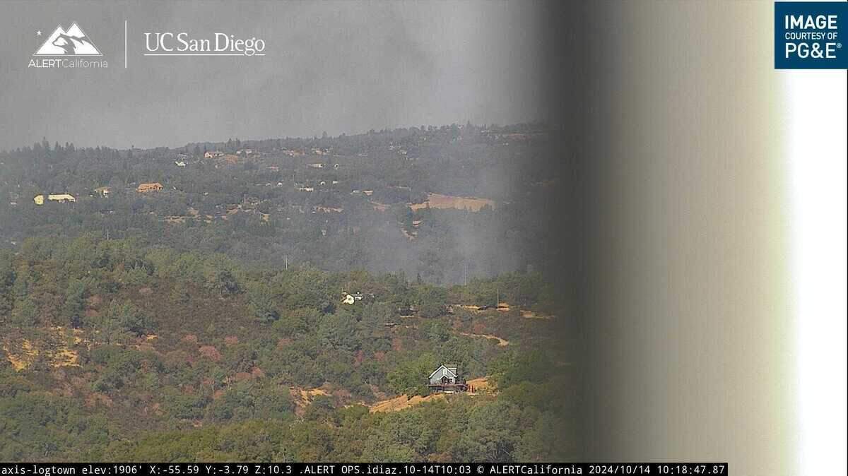 Smoke from the Ridge Fire is seen burning in Shingle Springs from a wildfire surveillance camera in Logtown. The fire broke out just after 10 a.m. on Tulle Lane, on the southern outskirts of the El Dorado County town.
