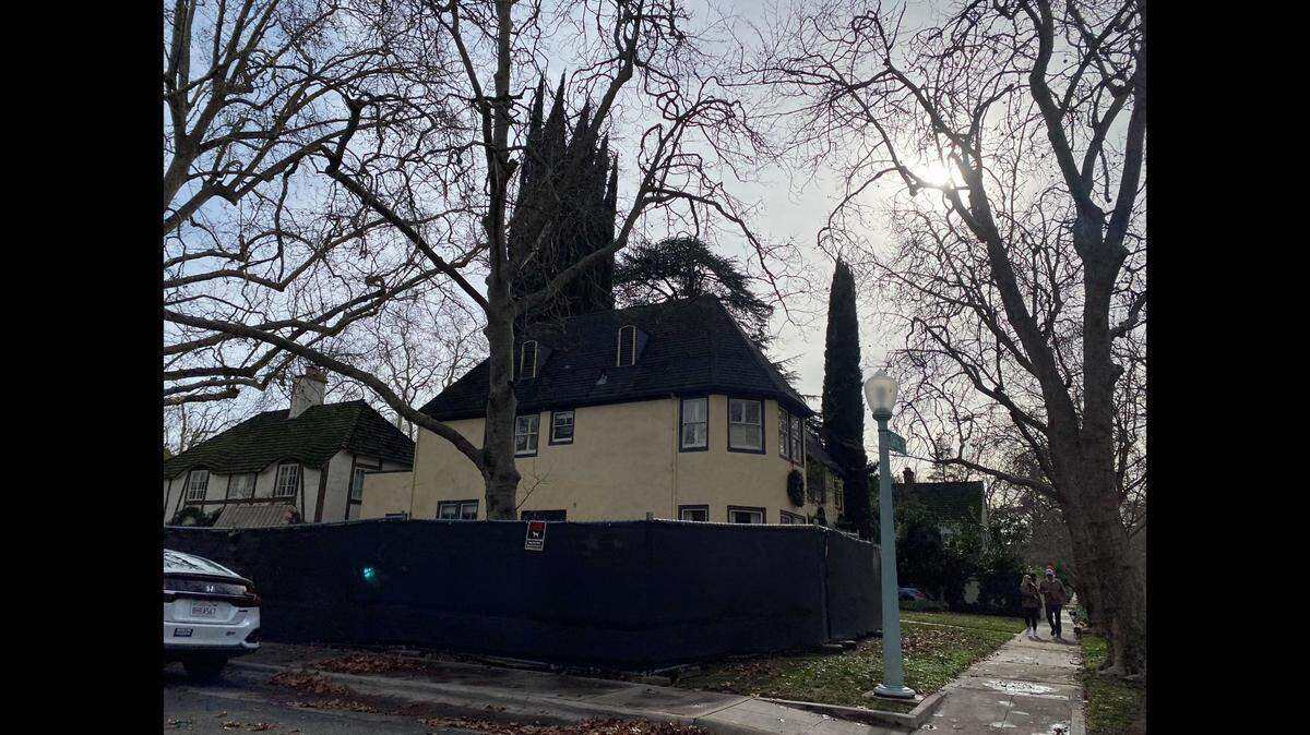 A temporary fence around a hot tub is shown around a Curtis Park house on Jan. 6, 2023. The city of Sacramento sued the homeowner and charged her over $270,000 for code violations, then dropped the lawsuit.