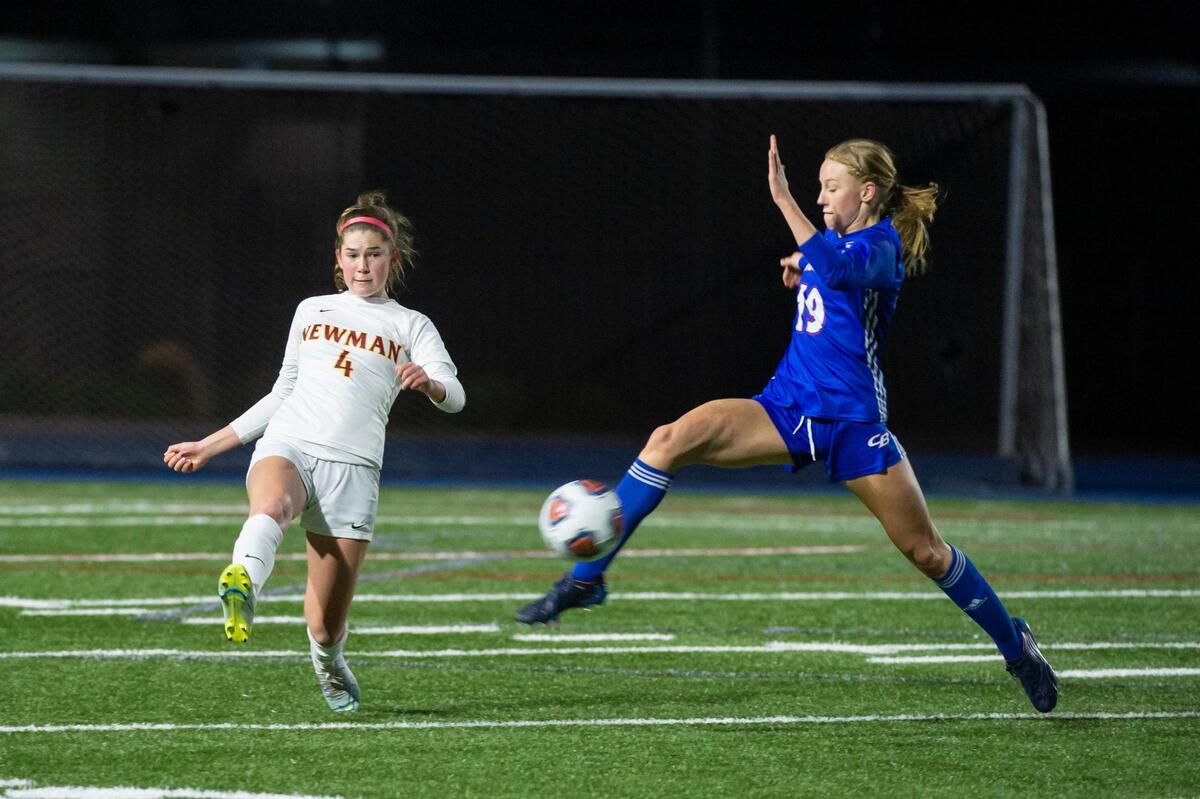 The Christian Brothers Falcons’ Lily Jensen (19) intercepts a pass to Cardinal Newman’s Amy Wilkinson (4) during the second half of the CIF NorCal Division III girls soccer championship on Saturday, March 4, 2023, at Christian Brothers High School in Sacramento. After being tied 1-1 in regulation time, the Falcons won 5-4 in penalty kicks.