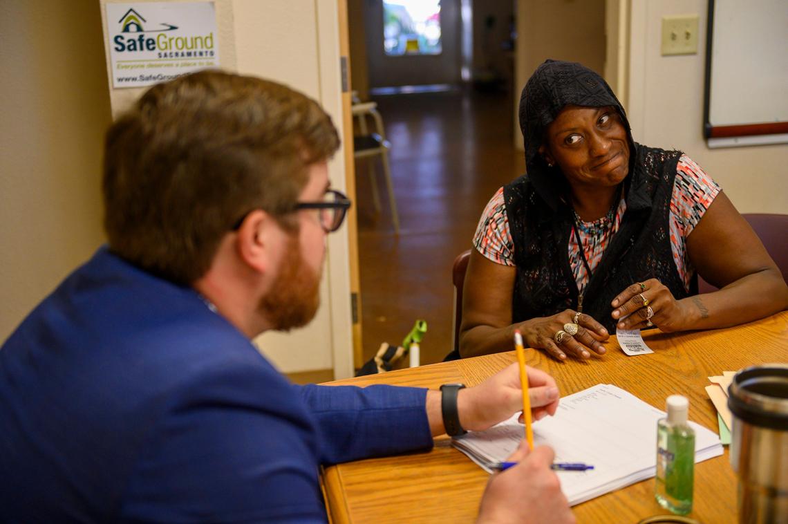 After counting 30 citations for riding the light rail and other infractions, Pubic Defender Robert Sorokolit, left, explains to Francis Gregory, 49, Wednesday, Sept. 25, 2019, that she needs to go to a court appearance in October during a free legal clinic for the homeless. Gregory hopes to clear her record and Sorokolit explained if she can show up to the court appointment they can begin the process by giving her community service for the money she owes for the citations. At the time, she owed the Sacramento County Superior Court $13,855.