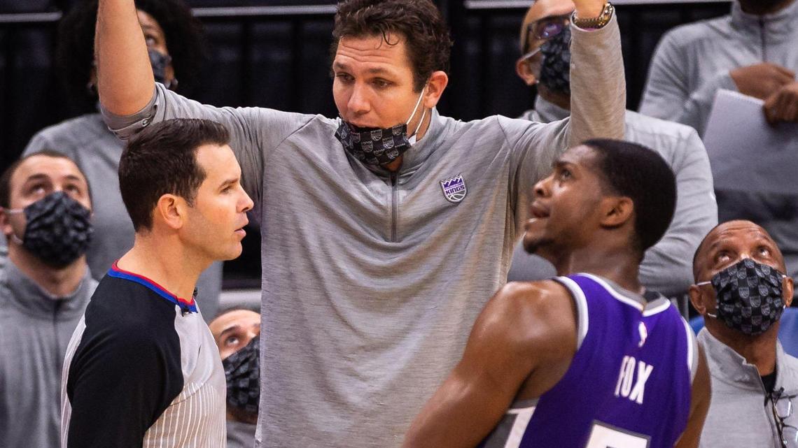 Sacramento Kings Luke Walton disagrees with referee Brian Forte (45) on a foul call against Sacramento Kings guard De’Aaron Fox (5) late in the fourth period against the New Orleans Pelicans during the fourth period of the NBA game Sunday, Jan. 17, 2021, at Golden 1 Center in Sacramento. The Kings lost to the Pelicans 128-123.