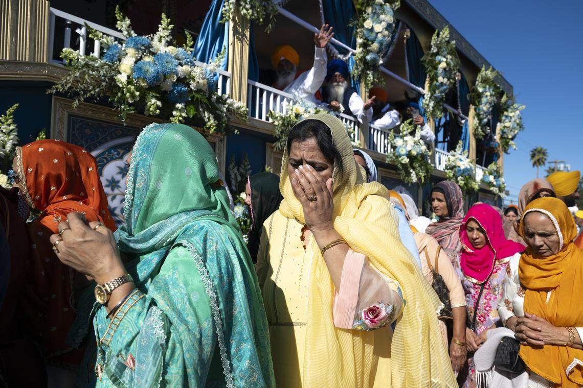 Members of the Sikh community follow the main float during Nagar Kirtan, also known as the Sikh Parade, in Sutter County on Sunday, Nov. 2, 2025.
