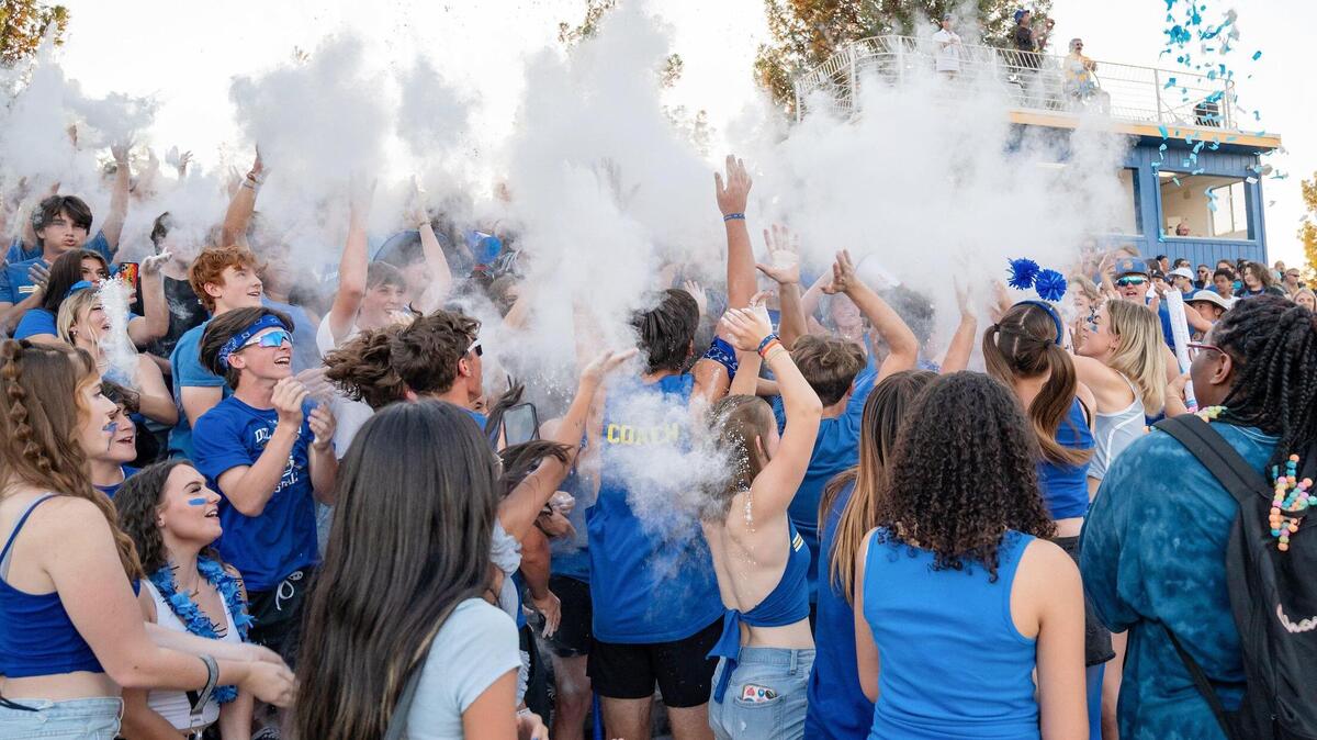 Del Campo fans throw baby powder in the air during the first kickoff in the game against the Bella Vista Broncos on Friday, Sept. 2, 2022, at Del Campo High School in Fair Oaks. The Cougars won 31-7.