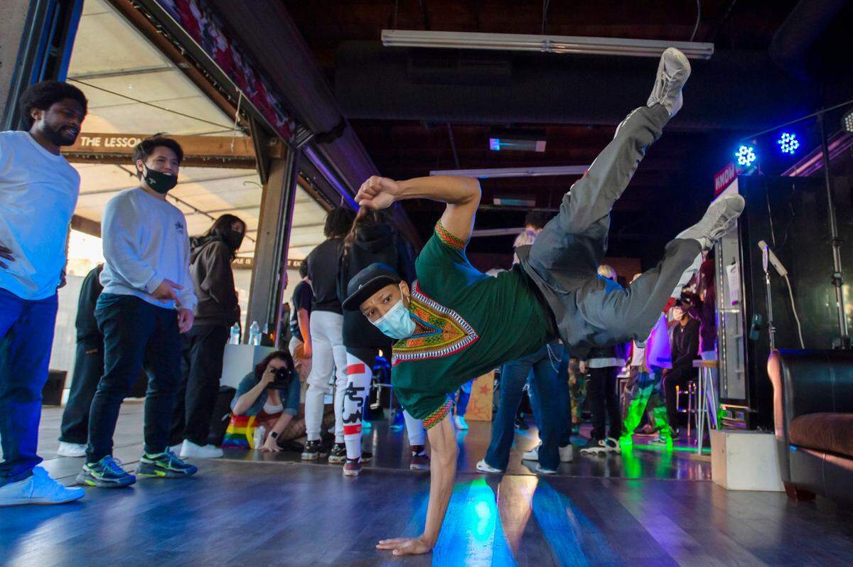 Morris Isby breakdances before the The Jam, a dance battle, at the Greathouse of Dance in Old Sacramento in January. “When I first met him, he was already outworking everybody in rehearsal,” said owner Brandon Greathouse, a key figure in the Sacramento breaking community.