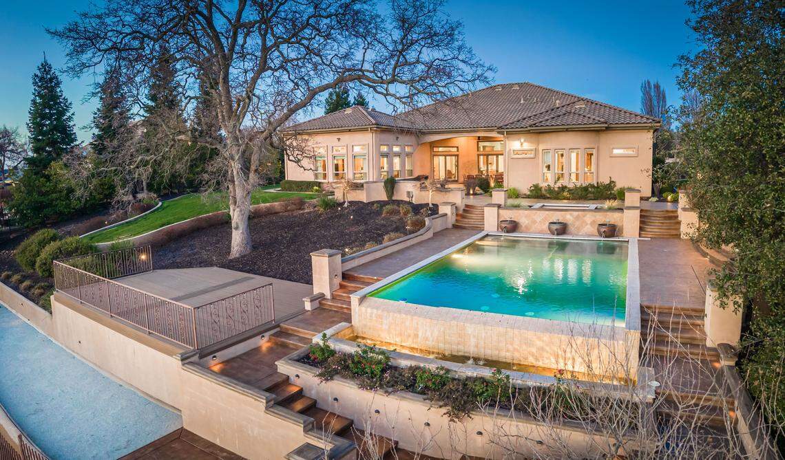 The resort-style backyard overlooks Catta Verdera golf course. A single-level, 6,300-square-foot residence in Lincoln, California, the estate has a bocce court, pool and a 750-bottle wine room.