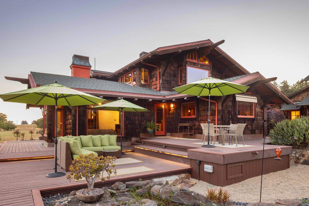The property includes a guest house, studio and other buildings.