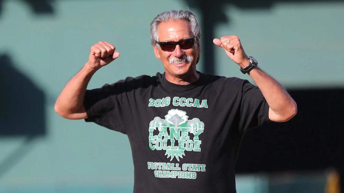 Laney College football coach John Beam reacts after throwing the ceremonial first pitch before the A’s take on the San Francisco Giants at the Oakland-Alameda County Coliseum in Oakland on Aug. 23, 2019. Laney died Friday after being shot Thursday on the Oakland college campus.