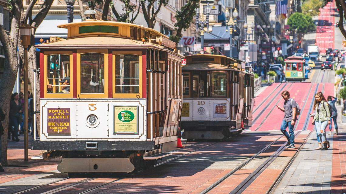 Six people were hurt when a cable car stopped abruptly to avoid colliding with a vehicle in San Francisco, California firefighters say.