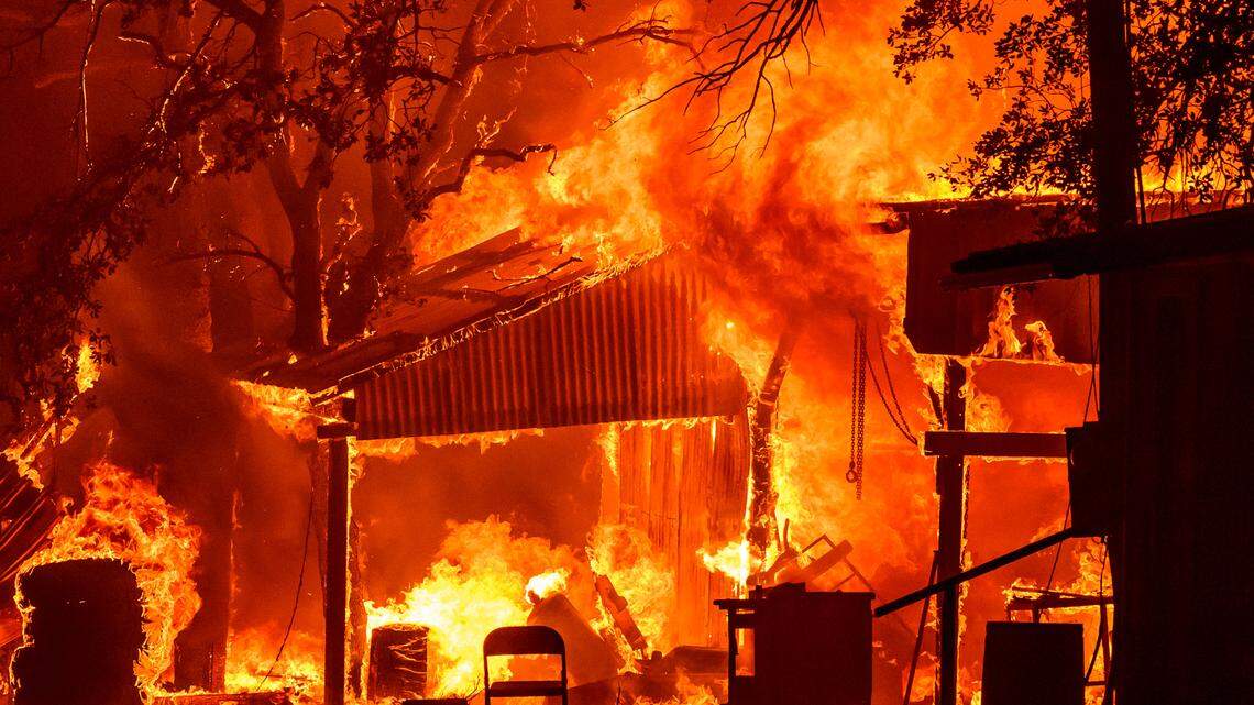 A property is seen in flames as the Park fire continues to burn near Paynes Creek in unincorporated Tehama County, California, on July 26, 2024. 