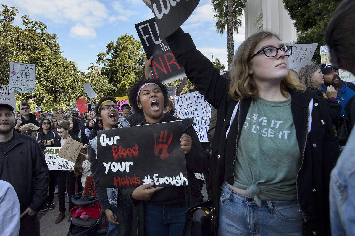 Fatara Sandress 16 of Marysville, center, and Julia Campbell 17 of Olivehurst, right, shout slogans and cheer for speakers on the steps of the state Capitol during the “March For Our Lives” demonstration in Sacramento.