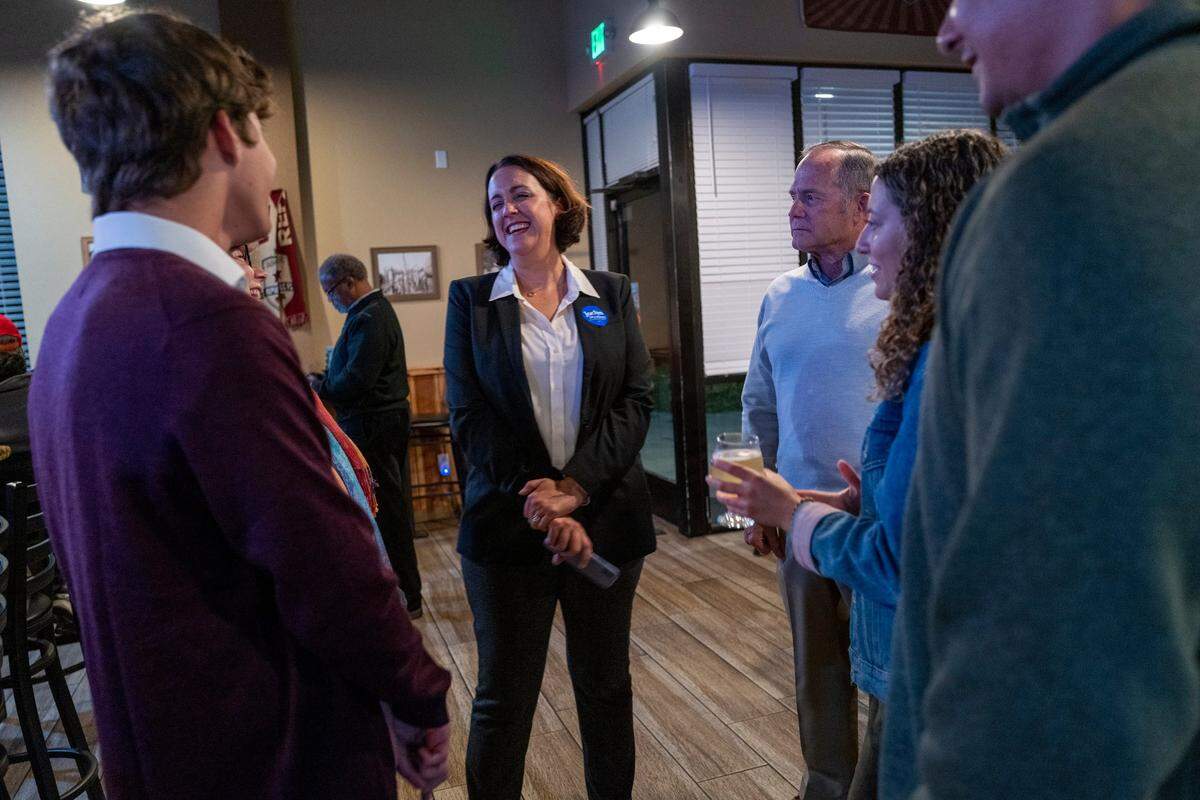 Sacramento County Board of Supervisors District 5 candidate Jaclyn Moreno, center, chats with her supporters at an election night party at Waterman Brewing in Elk Grove on Tuesday, Nov. 8, 2022.