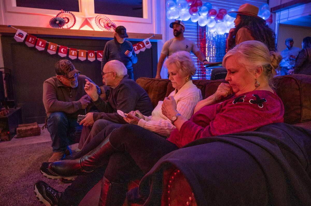 Sally Rapoza, right, and Linda Cadd look at election results on their cell phones on Feb. 1 in Palo Cedro. during the recall election to replace Shasta Supervisor Leonard Moty.