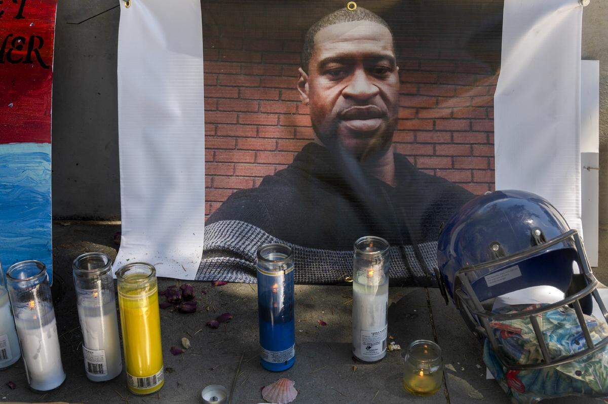 Candles are lit at a memorial for George Floyd at Cesar Chavez Plaza in Sacramento on Thursday, June 4, 2020.