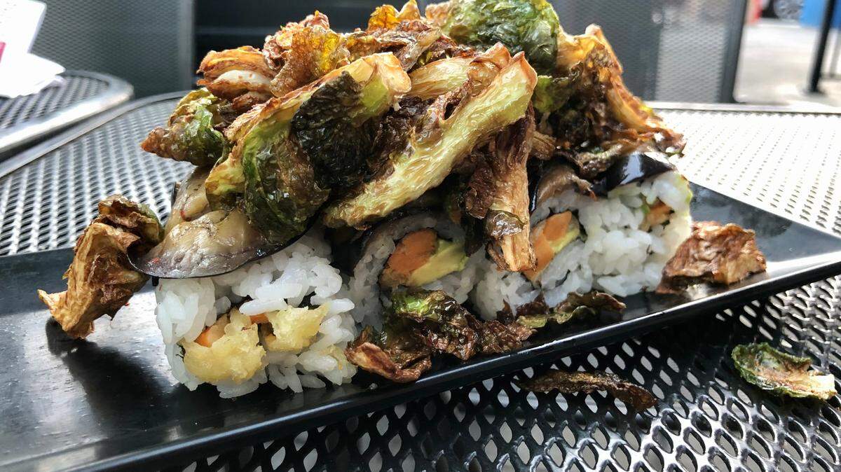 Midtown Sushi’s vegan Irishman roll comes with sweet potato, avocado, marinated eggplant and blackened Brussels sprouts.