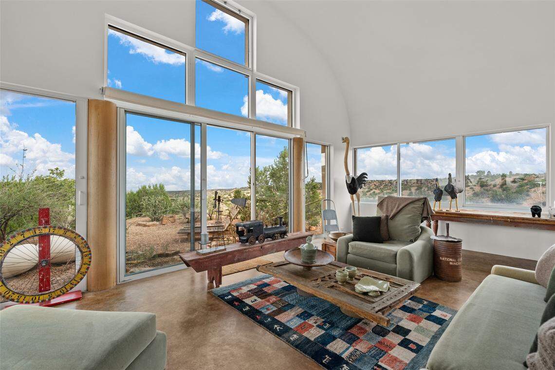Calle Encanto, nestled on a ridgeline in the exclusive Los Caminitos Subdivision in Santa Fe, N.M, sits on over 28 acres of rolling hills and Pinon Forest.
