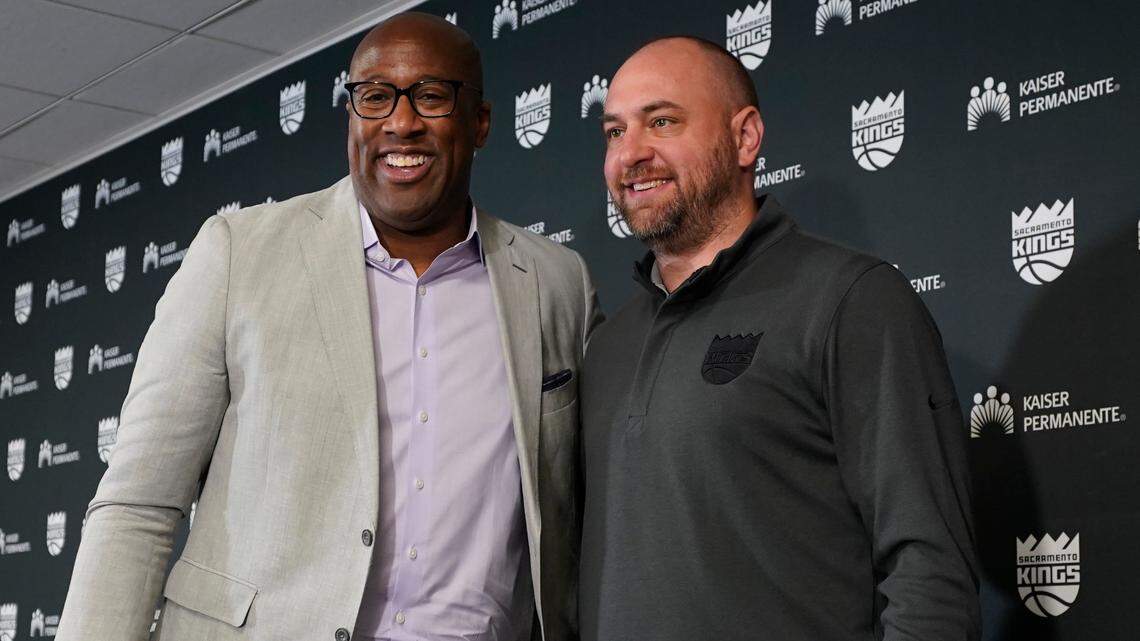 Mike Brown, left, the new head coach of the NBA Sacramento Kings basketball team poses for a photo with Kings general manager Monte McNair, right, in Sacramento, Calif., Tuesday, June 21, 2022. Brown, who this season was an assistant coach with the NBA Champion Golden State Warriors, is taking over the franchise with the longest playoff drought in NBA history. (AP Photo/Rich Pedroncelli)