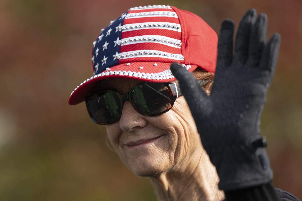 A parade participant wears an American flag hat during a Veterans Day parade in Folsom on Tuesday, Nov. 11, 2025.