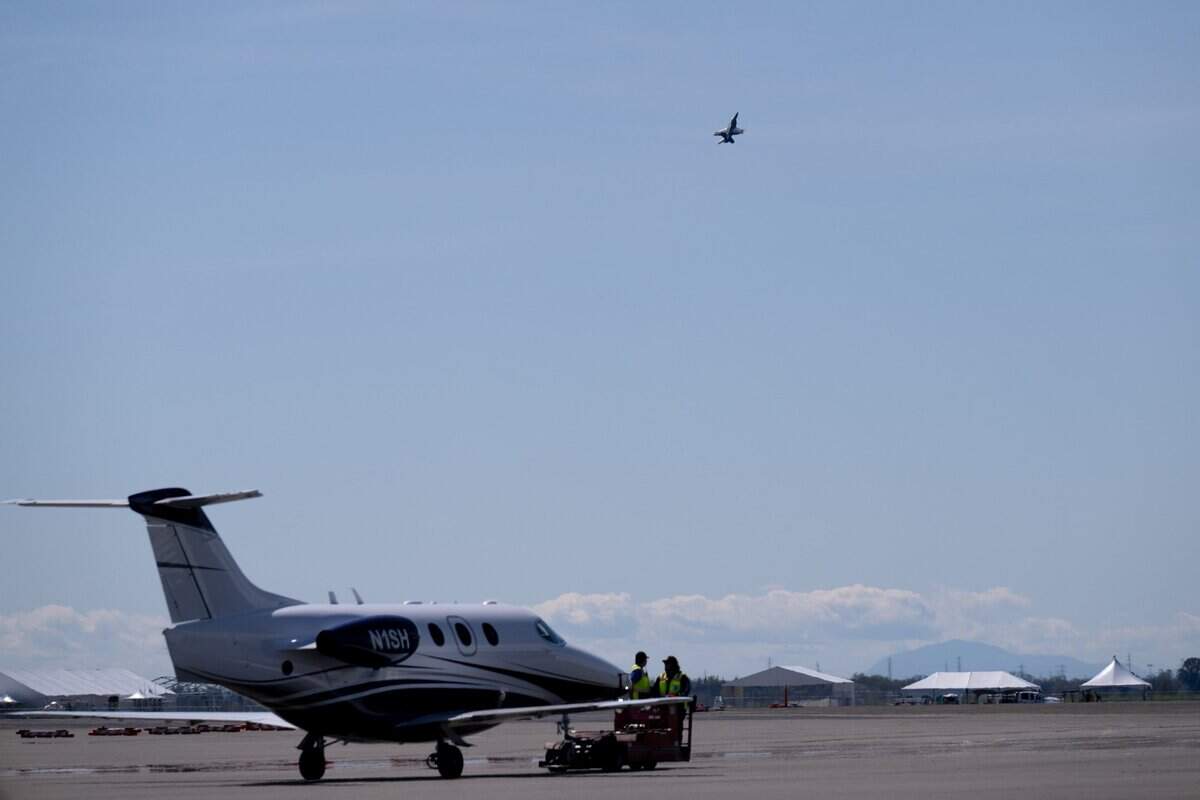 Mills Middle School teacher Jason McKnight and Blue Angels pilot Maj. Scott Laux lift off at Mather Airport for a 45-minute flight on Tuesday.