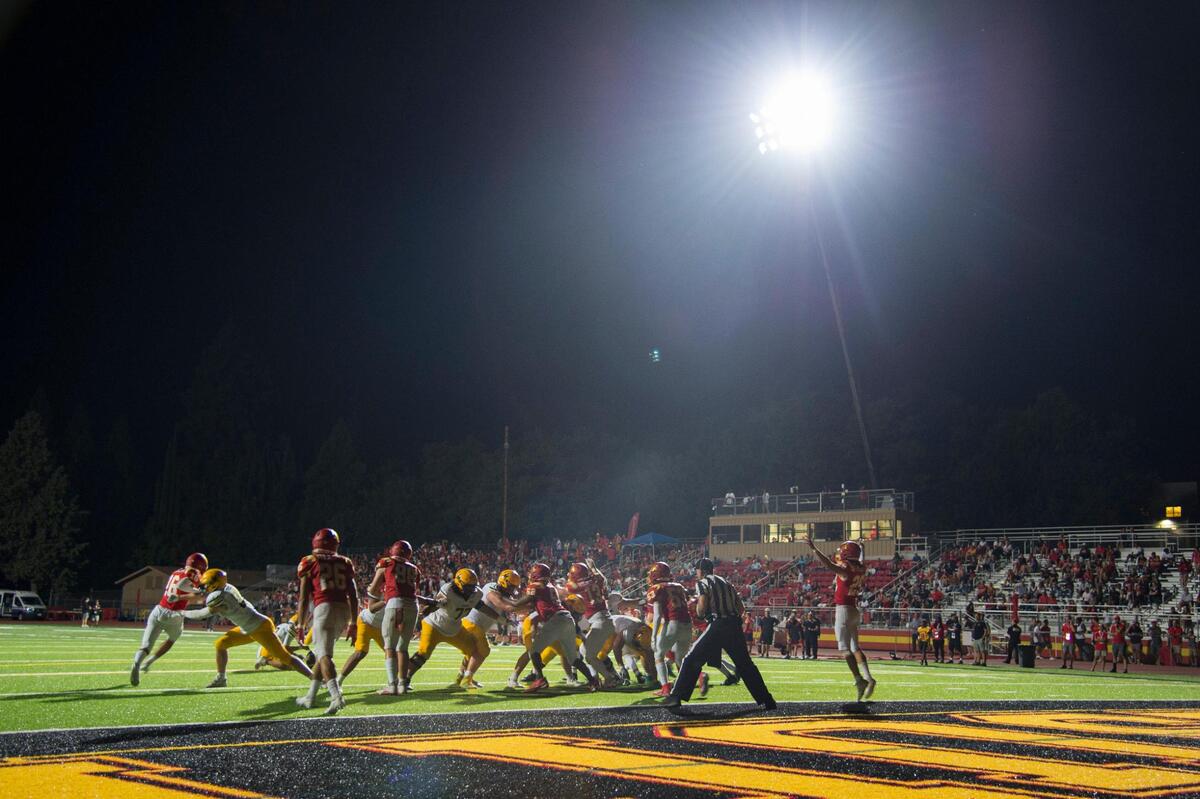 The Jesuit Marauders host Bishop Manogue Miners under lights for a high school football game at Jesuit High School on Friday in Carmichael. Jesuit usually plays during the day and used two portable lights to make this night game possible.