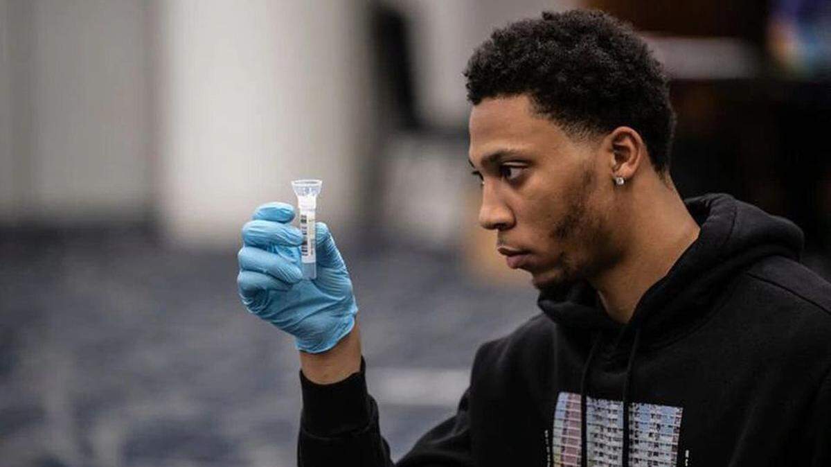 Former Sacramento Kings guard Malachi Richardson examines a saliva sample provided for COVID-19 testing on July 1, 2020, in Columbus, Ohio for The Basketball Tournament. Richardson played for Boeheim’s Army in the tournament.