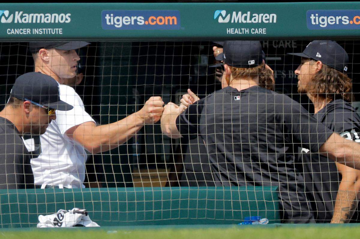 Detroit Tigers starting pitcher Matt Manning (left) receives congratulations from teammates after being relieved in the seventh inning against the Toronto Blue Jays on July 8, 2023, at Comerica Park in Detroit, Michigan.