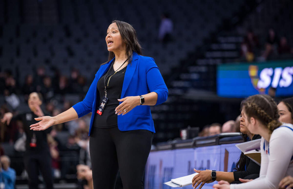 Christian Brothers Falcons head coach Shandyn Foster talks to her players after a foul in favor of the Whitney Wildcats during the second quarter of the CIF Sac-Joaquin Section Division II high school girls basketball final game Friday, Feb. 24, 2023, at Golden 1 Center in Sacramento.