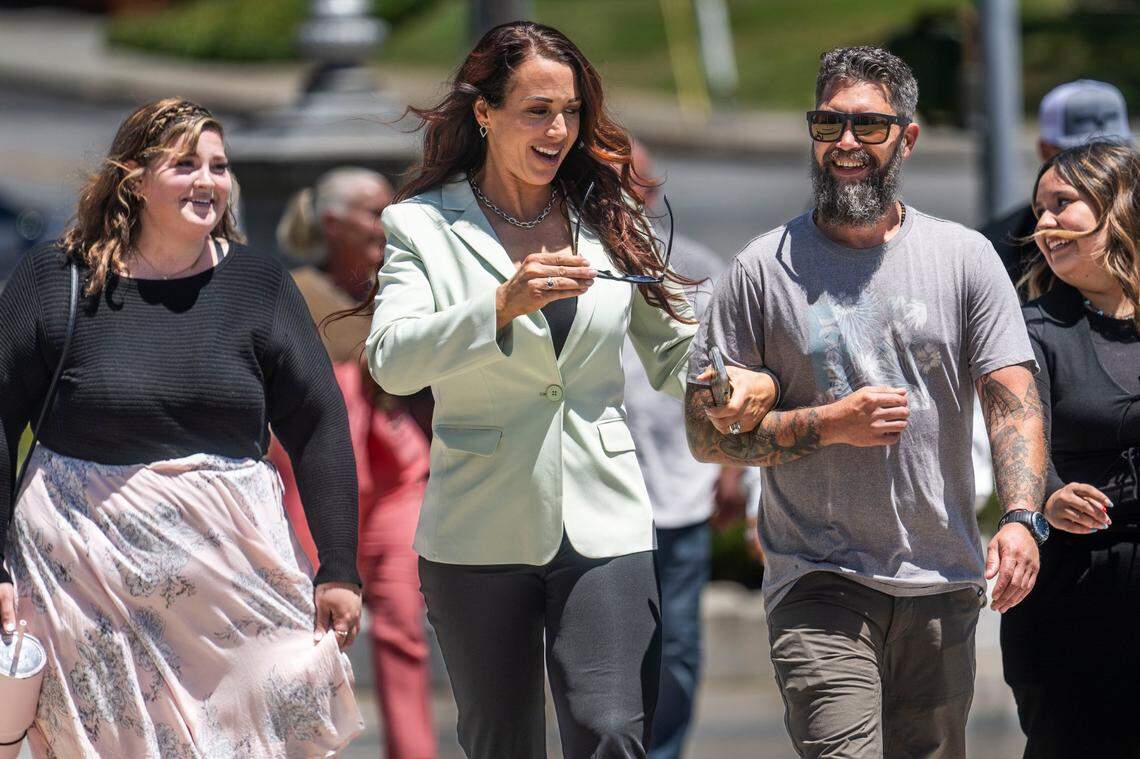 Erin Spohr, center, the wife of former major league baseball player Daniel Serafini who is on trial for allegedly murdering his in-laws, returns to court to watch the closing arguments by attorneys David Dratman in Placer Superior Court in Auburn on Tuesday.