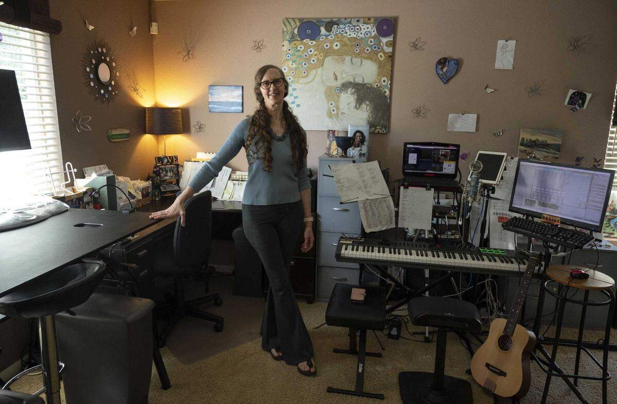 Sacramento attorney Tiffany Clarks stands in her home office in October where she also composes music. Clark makes less than $10,000 a year at her part-time Sacramento law practice, so paying the city $684 in professional business tax fees feels too steep.