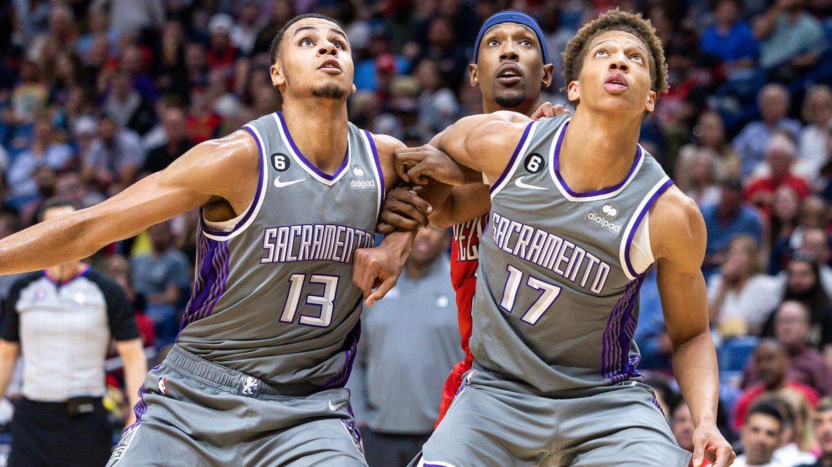 Sacramento Kings forward Keegan Murray (13) and forward Kessler Edwards hold back New Orleans Pelicans guard Josh Richardson (2) on a rebound during the second half at Smoothie King Center on April 4, 2023.