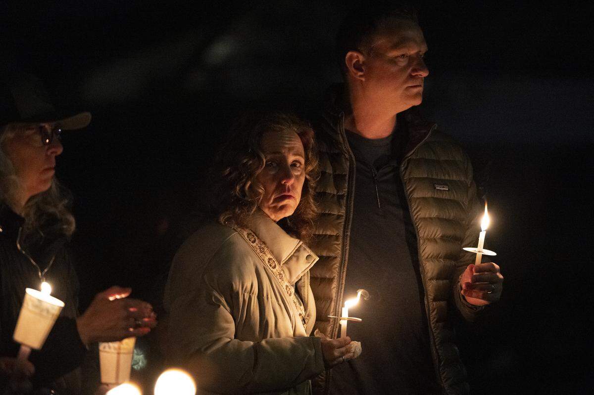 Abbie Mouillesseaux, center, tears up during a vigil outside the home of Lindsey Peralta Vallerga and David Edward Vallerga on Mill Water Circle in Rancho Cordova on Sunday after the Vallergas and their children were found dead on Jan. 27 in an apparent murder-suicide.