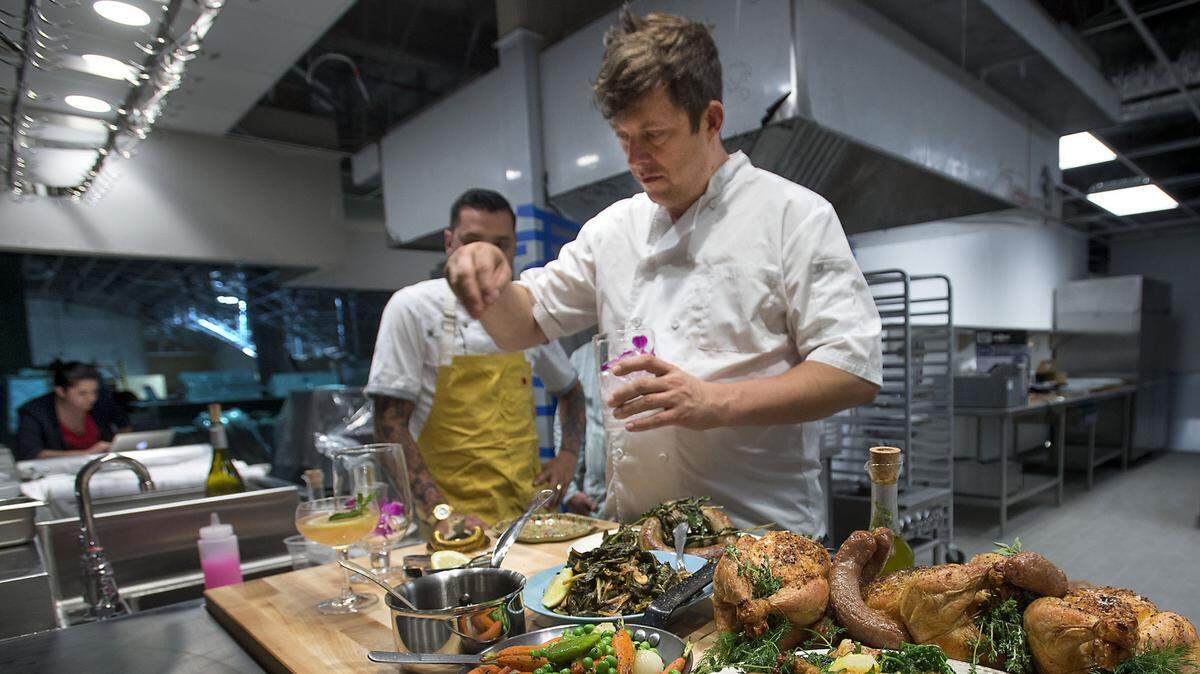 Empress restaurant co-owner Mike Thiemann prepares some dishes at the restaurant in Sacramento in 2015.