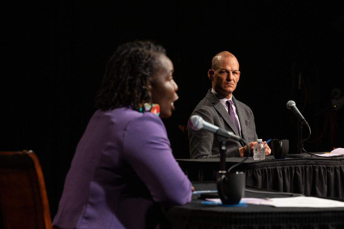 Sacramento mayor candidate Kevin McCarty, right, listens as his opponent Flojaune Cofer responds to a question during a mayoral debate sponsored by The Sacramento Bee and KVIE on Wednesday, Oct. 23, 2024.