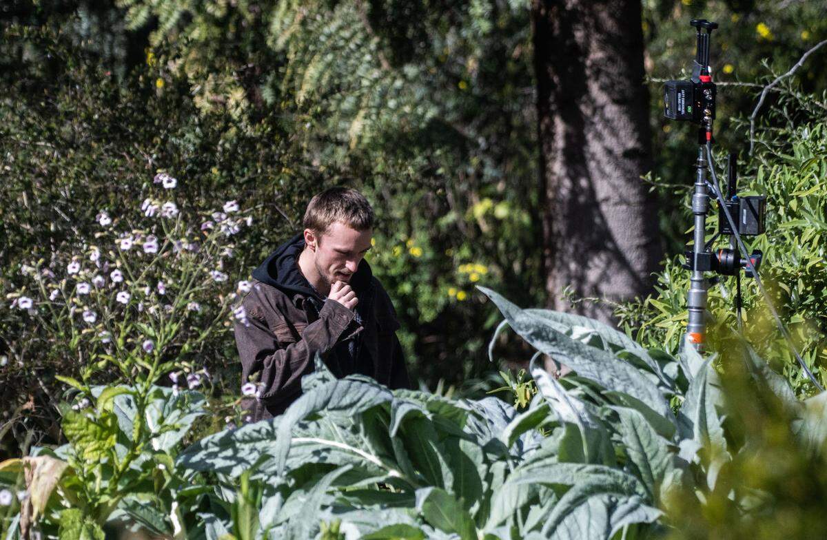Actor-stuntman Lukas Stoiber walks through Sacramento’s William Land Park during the filming of “No Address” on Wednesday. Stiobe plays the character Red.